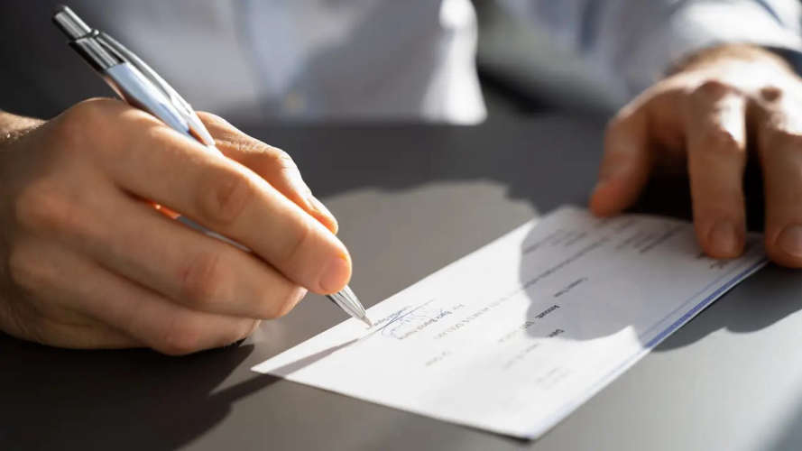 up to two years imprisonment and fines for incorrect signature on cheque